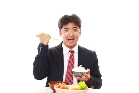 Happy man eating mealsの写真素材