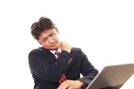 Businessman who has a shoulder pain.の写真素材