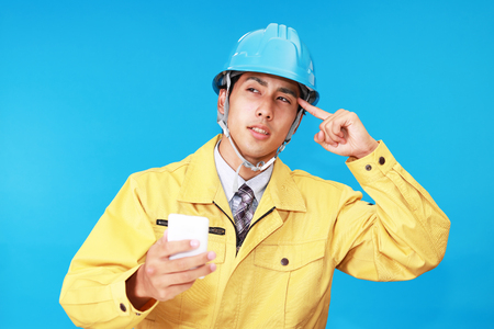Portrait of worker looking uneasy.の写真素材