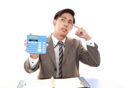 Portrait of businessman looking uneasyの写真素材