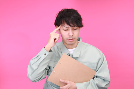 Tired and stressed Asian worker
