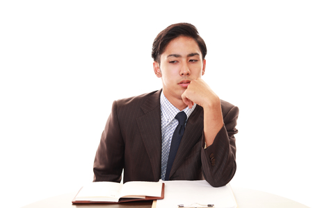 Tired Asian businessmanの写真素材