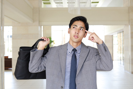 Portrait of businessman looking uneasyの写真素材