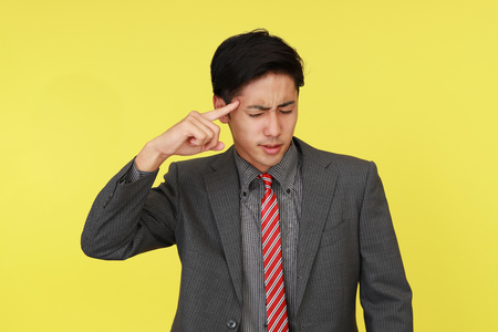 Portrait of businessman looking uneasy.の写真素材