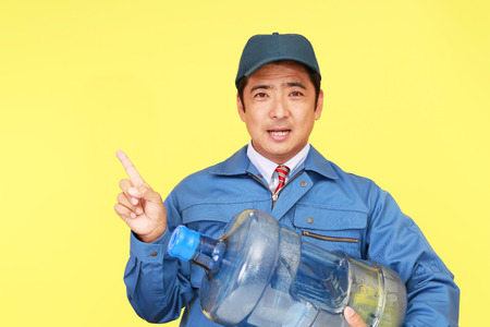 Worker with a container of waterの写真素材