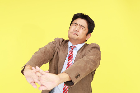 Tired Asian businessmanの写真素材