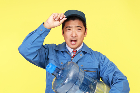 Worker with a container of waterの写真素材