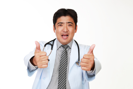 Doctor showing thumbs up signの写真素材