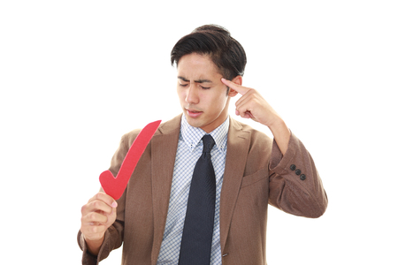 Portrait of businessman looking uneasyの写真素材