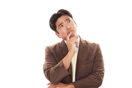 Portrait of businessman looking uneasyの写真素材