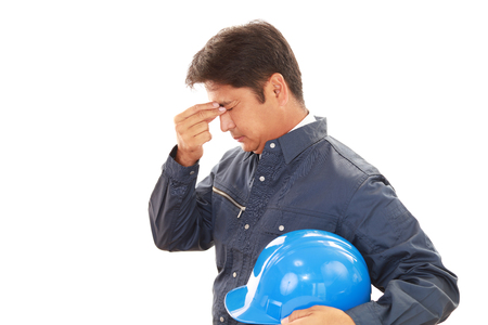 Worker having a headacheの写真素材