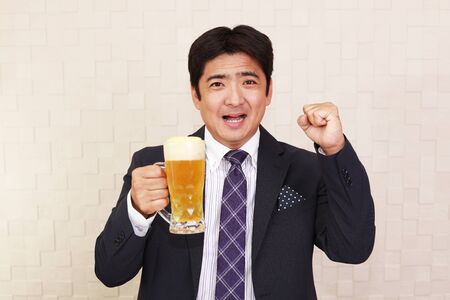 Man drinking beerの写真素材
