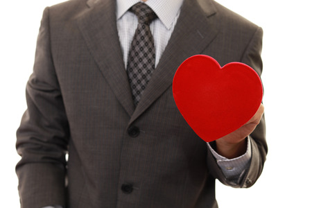 Handsome man with a heart of love.の写真素材