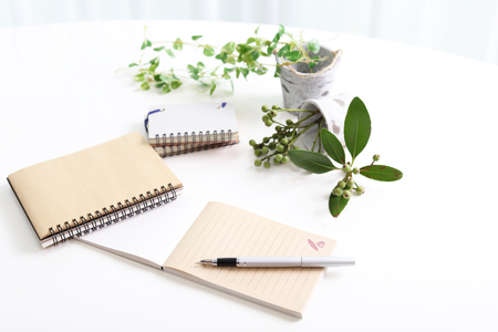 Notebooks and penの写真素材