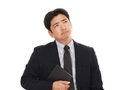 Dissatisfied Asian businessmanの写真素材