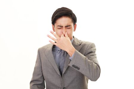 Man pinches his noseの写真素材