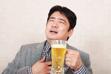 Man drinking beerの写真素材