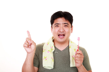 Man with toothbrushの写真素材