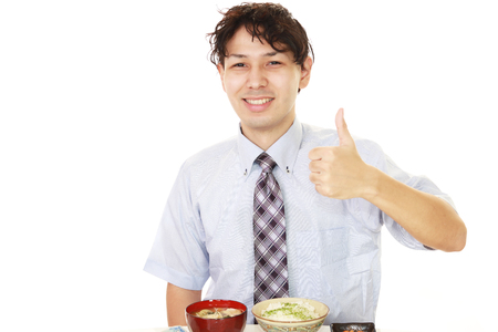 Happy man eating mealsの写真素材