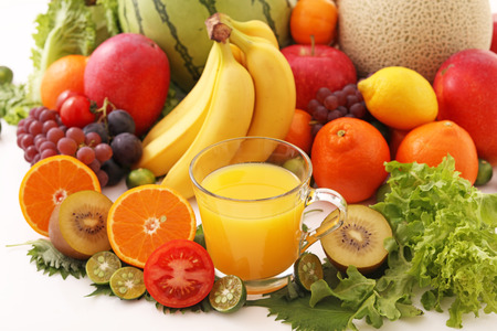 Fresh fruits with a glass of juiceの写真素材