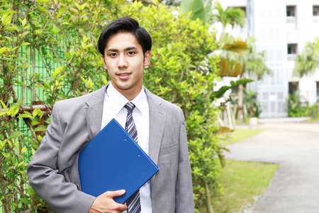 Smiling Asian businessmanの写真素材