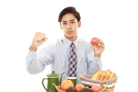 Happy man eating mealsの写真素材