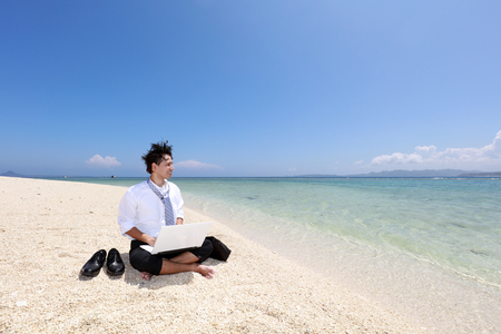 The man who relaxes on the beach.の写真素材