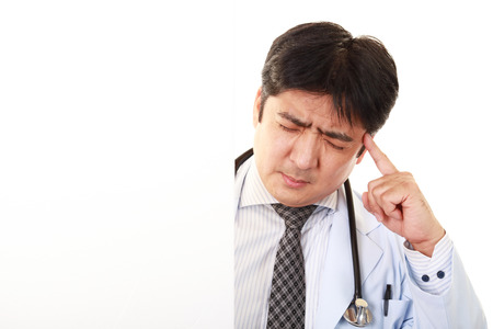 Portrait of  medical doctor looking uneasyの写真素材