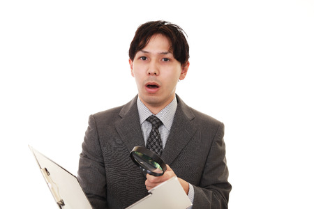 Surprised Asian businessmanの写真素材