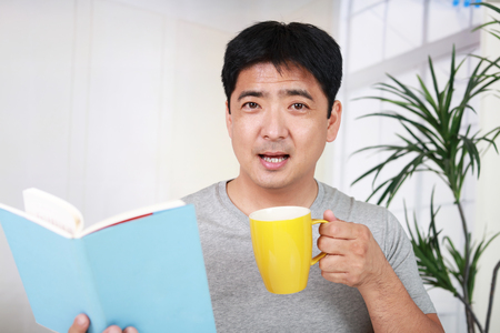 Man reading a bookの写真素材