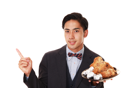 Smiling Asian waiterの写真素材