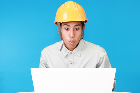 Surprised Asian workerの写真素材