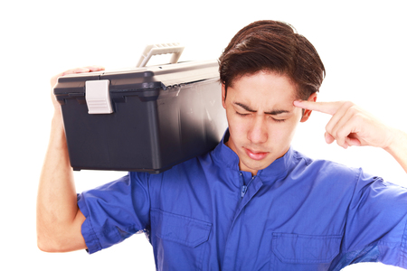 Tired and stressed Asian workerの写真素材