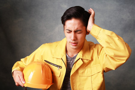 Worker having a headache