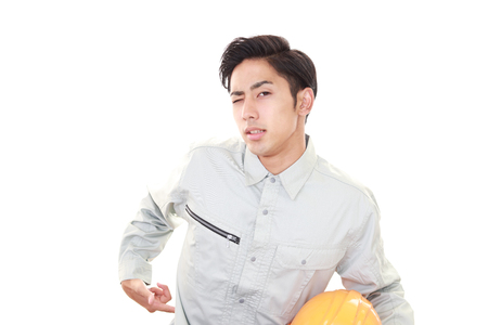 Worker having a back painの写真素材