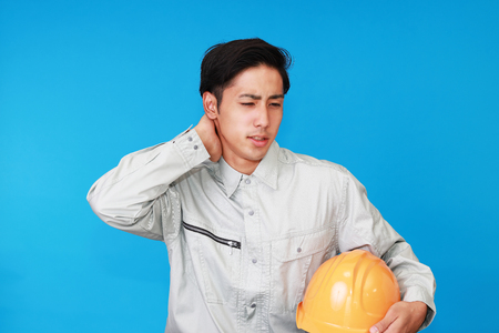 Tired and stressed Asian workerの写真素材