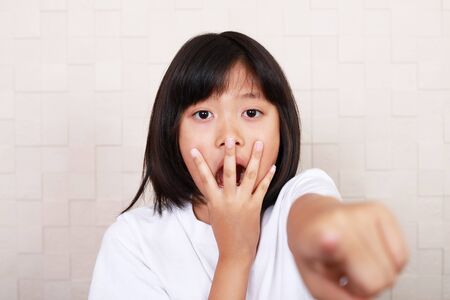 Surprised Asian girlの写真素材
