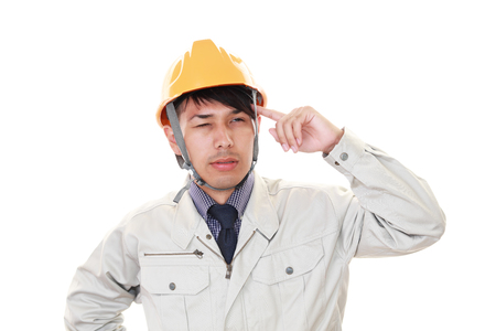 Tired and stressed Asian workerの写真素材