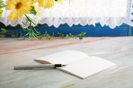Notebook and pen on the desk.の写真素材