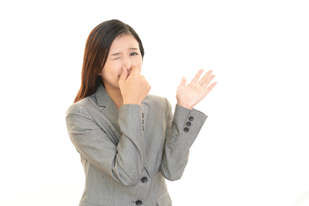 Woman pinches her noseの写真素材