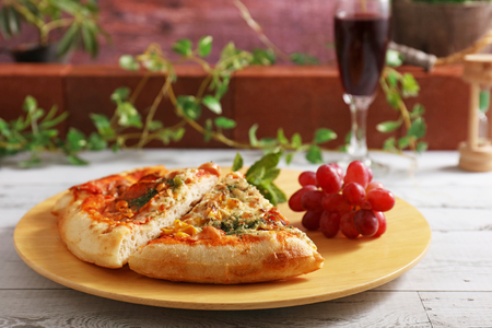 Delicious pizza and a glass of wineの写真素材