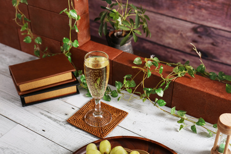Fresh fruits and a glass of wineの写真素材