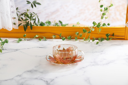 A cup of tea on the dining tableの写真素材