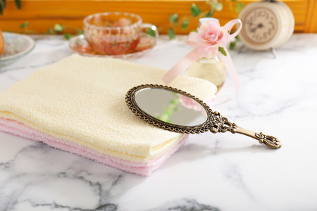 Stylish hand mirror and towelsの写真素材