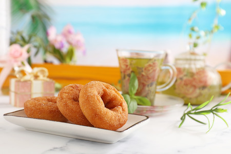 Delicious sweets and herbal tea on the dining tableの写真素材
