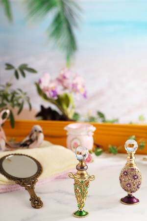 Bottles of perfume on the tableの写真素材