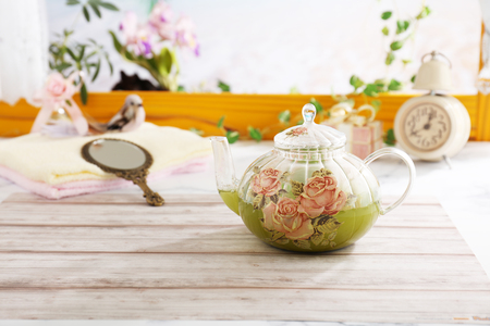 A pot of herbal tea on the dining tableの写真素材