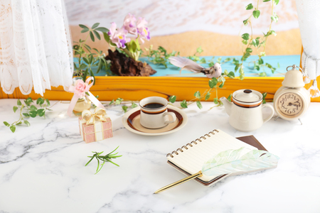 Notebooks and quill pen on the deskの写真素材