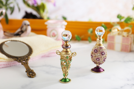 Bottles of perfume on the tableの写真素材