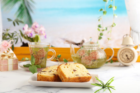 Delicious sweets and herbal tea on the dining table